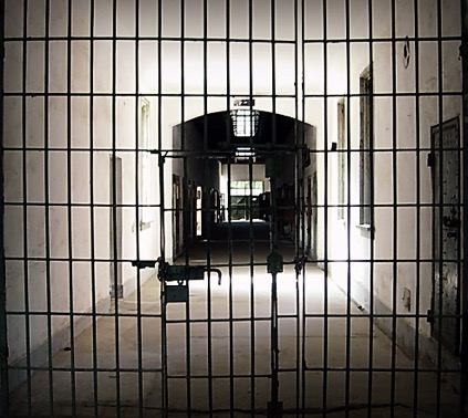 Prison hallway with locked gate