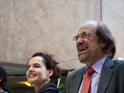 Two sociologists laughing, one is female and the other is male