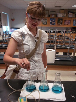 Female student in chemistry lab working with chemicals