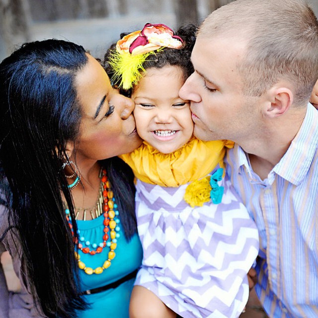 Interracial couple with their daughter