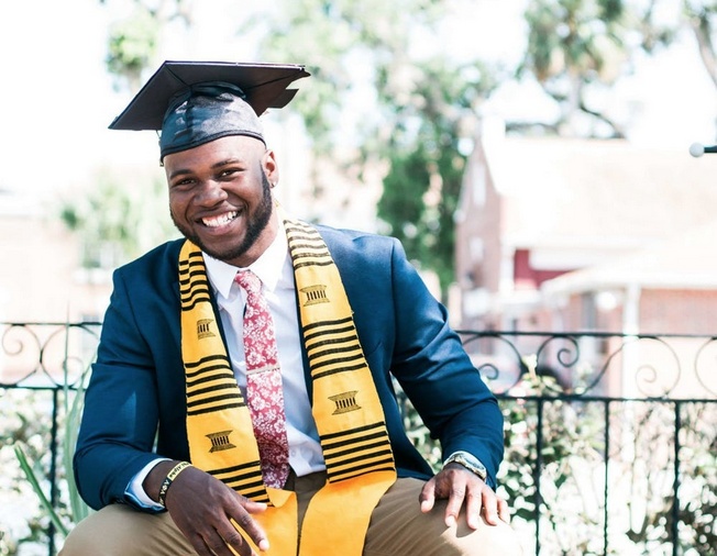 image of Black man in graduation cap