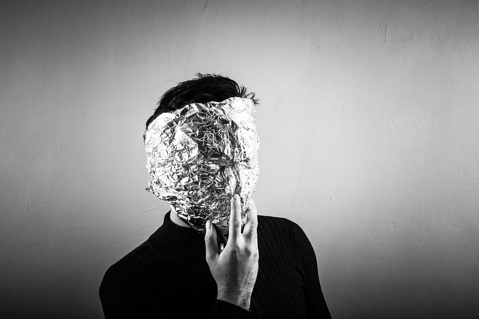 person wearing a tin foil mask