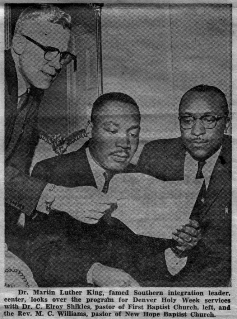 Martin Luther King, Jr., reviewing a document with two other men