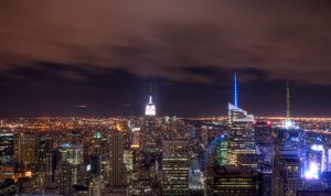 The New York City skyline at night is shown here