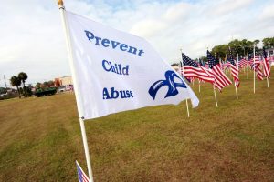 A flag with the words Prevent Child Abuse on it