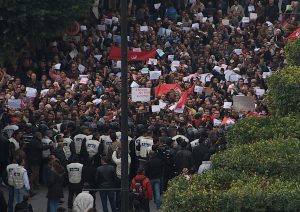 A large group of people marching in protest