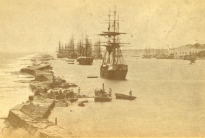 The natural harbour of Recife, shown with tall ships around 1890.