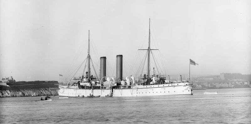 HMS Sirius, the Royal Navy ship protecting English shipping, in 1890. A light-colored warship with funnels and sailing masts.