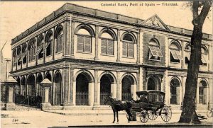 A postcard of the Colonial Bank in Port of Spain with a horsedrawn carriage parked outside. From around 1898.
