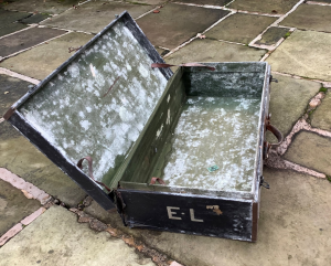 Elsa Loewenthal's battered suitcase, in which the letters were stored. It is a sold metal trunk, somewhat weathered on the inside, but clearly a safe place to store letters.