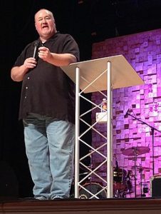 Chris Elrod speaking to a church