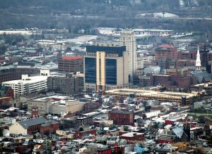 Photograph of downtown Reading, Pennsylvania, with tall buildings, factories, brick homes, and churches.