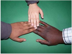 Image of hands: Human skin color ranges from dark brown to light pink