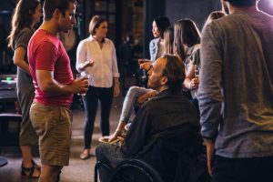 Photo of people having a conversation at a party.