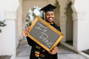 A photo of a college graduate celebrating his graduation.