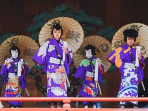 Four actors appear in vibrant attire in a traditional Kabuki performance in Tokyo, Japan.