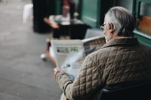 A man reading a newspaper.