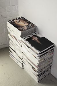 A stack of Vogue magazines.