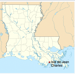 Map of Louisiana with the Isle de Jean Charles indicated by a red dot at the bottom of the state on the coast.