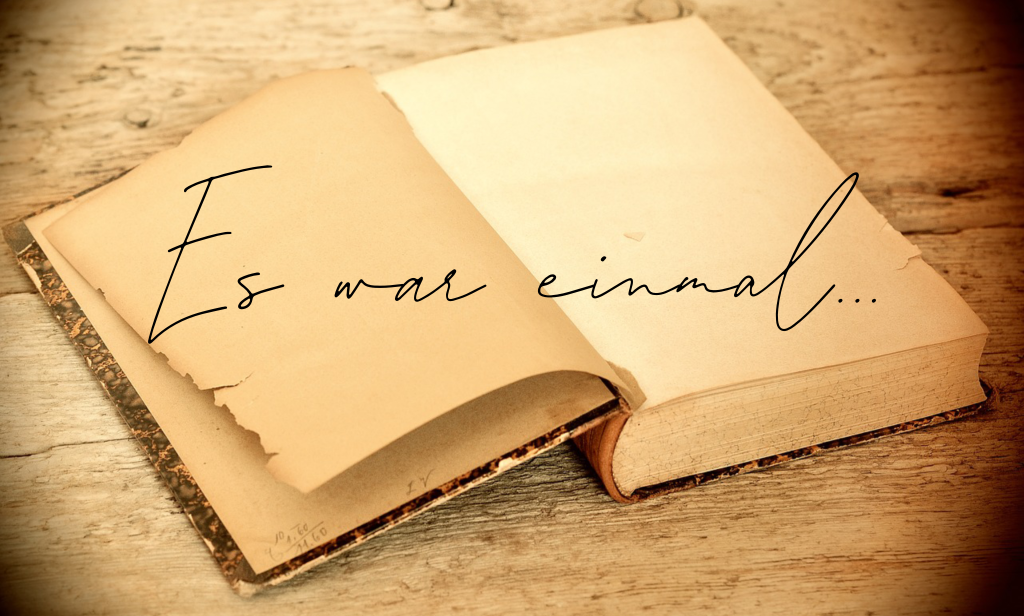 "Es war einmal" written across an open book